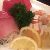 Sashimi Appetizer · Chef's special sampler of 9 pieces sliced fresh raw fish.