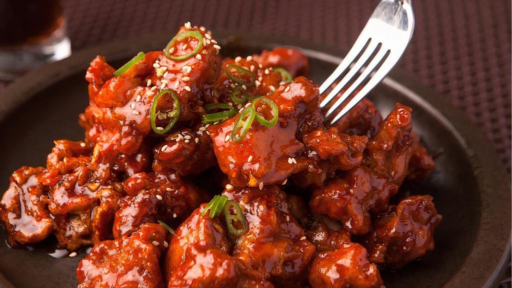 Fiery Chilli Chicken · Crispy fried chicken with diced onions and bell peppers and sauteed in tangy sauces