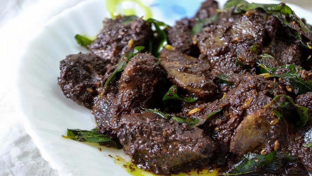 Chef'S Special Pepper Goat Fry · Delicious goat meat coated in chef's special thick flavorful masala sauce