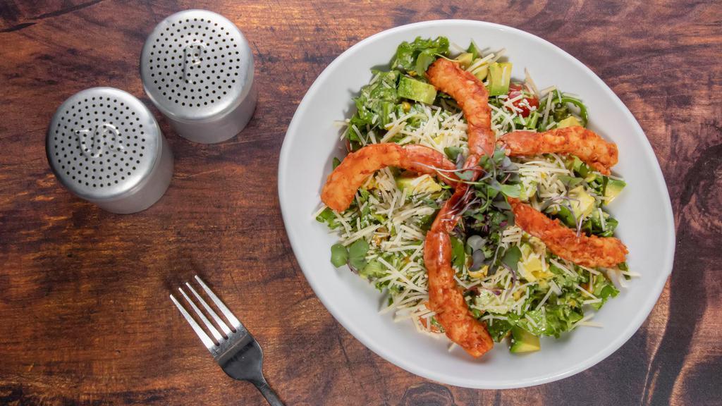 Smoked Shrimp Salad · Smoked seasoned shrimp, romaine, arugula, corn, cucumbers, tomatoes, avocado, and Parmesan crisps served with stockyard's green goddess dressing.
