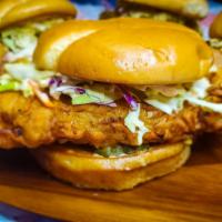 Tandoori Fried Chicken Sandwich · Spiced yogurt marinated chicken roasted then deep-fried golden brown topped with pickles, sw...