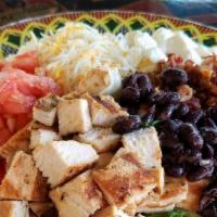 Mexican Cobb · Grilled Chicken, Cheddar and Jack Cheese,tomatoes, bacon, queso fresco, and black beans serv...