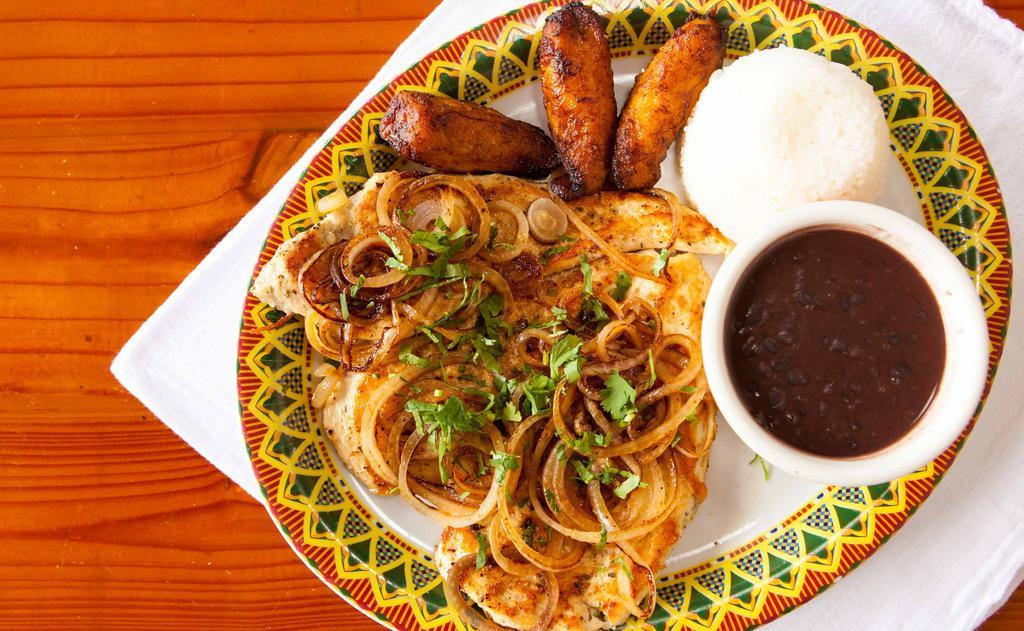 Pollo A La Plancha · Grilled Chicken breast topped with Grilled onions, cilantro and lime. Served with white rice, black beans and plantains.