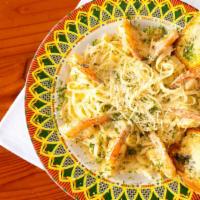 Shrimp Scampi · Succulent Shrimp in the tastiest garlic butter and wine sauce drizzled with freshly squeezed...
