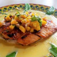 Miso Salmon · Topped with miso glaze and mango salsa. Served with white rice and snow peas.