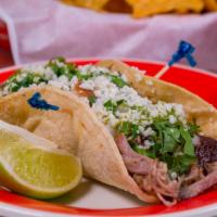 Carnitas · Slow roasted chunks of pork topped with grilled onions cilantro and pico de gallo. served wi...