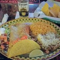 Puerta Vallarta · One cheese enchilada and one chicken enchilada topped with salsa ranchera and a crunchy Beef...