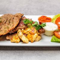 Mixed Grill · Cevapi, pljeskavica, sudzukice, chicken, kajmak, ajvar, and fresh pita bread.