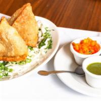 Vegetable Samosa (2 Pieces) · Crisp pastry stuffed with delicately spiced potatoes, peas and herbs.