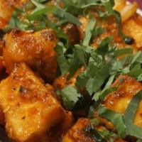 Chili Paneer(App) · Homemade cheese, onion, tomatoes and bell peppers cooked in our special sauce.