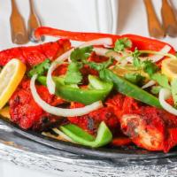 #35A. Tandoori Chicken · Chicken marinated in yogurt and freshly ground spices, then broiled in the tandoor.