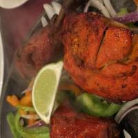 #35B. Tandoori Chicken(Full) · Chicken marinated in yogurt and freshly ground spices, then broiled in the tandoor.
