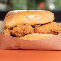 Chick'Nsandwich · Crispy fried chicken tenders, with pickles served in a split top brioche roll! Need More ADD...