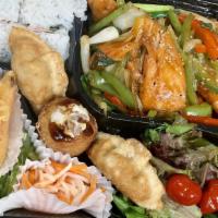 Salmon Bento Box Dinner · Served with Salad, California Roll, Fried Gyoza, Vegetable Tempura, Takoyaki, Steamed Rice o...