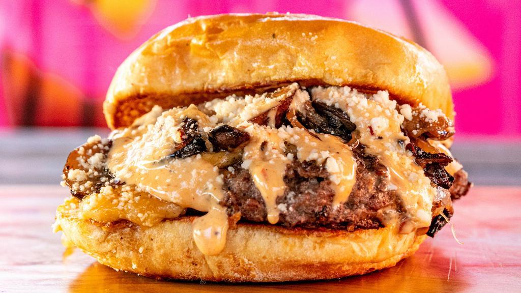 Dirty South Burger · All beef smash burger, cheddar cheese onions, vinegar poached mushrooms, la jama sauce.