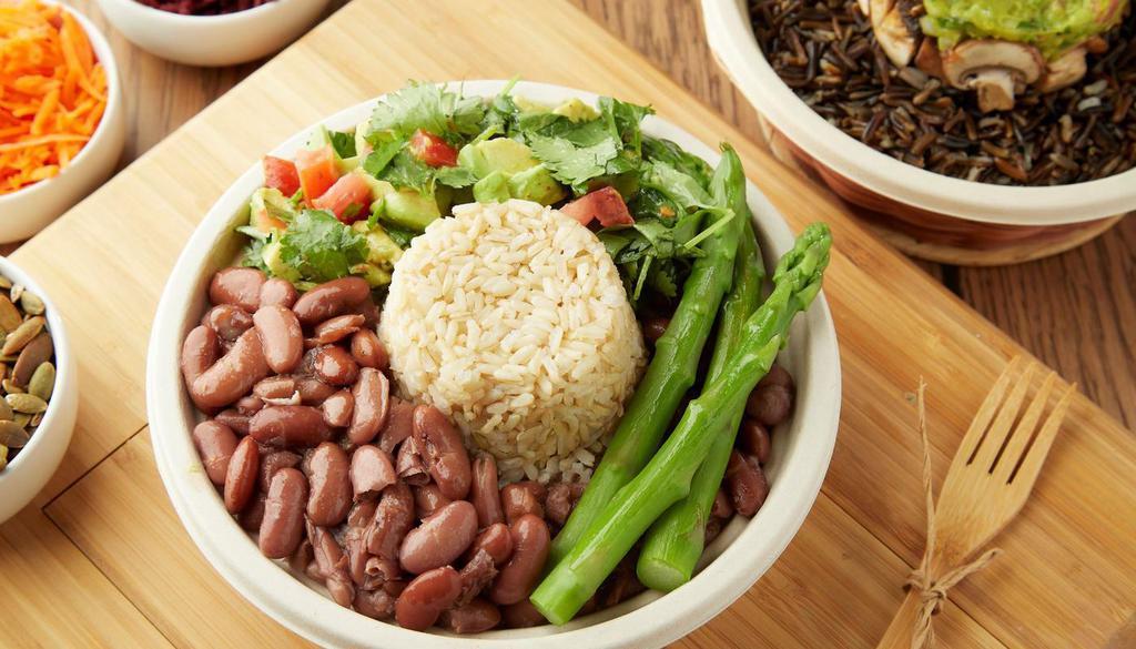 Frijoles Bowl · Integral bowl with kidney beans, brown rice, asparagus, avocado, tomato.                                                                                               Bowl integral con frijoles, arroz integral, esparragos, aguacate, tomate.