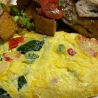 Spicy Hill Style Omelet   · onion, tomato, cheese, Spinach and bell peppers with Breakfast potato.