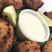 Conch Fritters · Eight conch fritters and spicy remoulade.