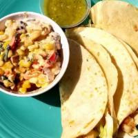 Fish Tacos · Fried, grilled or blackened tilapia, cabbage, house jalapeno tartar, salsa Verde, black bean...
