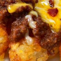 Chili Cheese Bacon Tots · Spuds loaded to the max with chili, cheese, bacon.