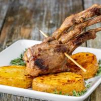 Lamb Chops · Grilled marinaded lollipop lamb chops, served with homemade house potatoes.
