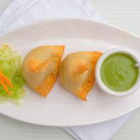 Samosas · Indian version of empanadas stuffed with chicken / lamb / cottage cheese and spinach / potat...