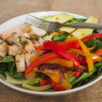 Chicken Fajita Salad · Creamy avocado slices, gilled red and yellow pepper strips, grilled red onions, romaine lett...