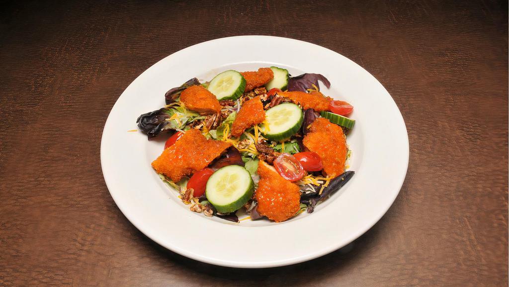 Buffalo Chicken Salad · Tossed in our special buffalo sauce, chopped romaine lettuce, baby spinach, carrots, red onions, celery, fresh bell peppers, a splash of lime, topped with blue cheese crumbles and dressing