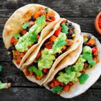 Vegan Tacos · Vegetarian. Three tacos packed with black beans, Pico de Gallo, avocado, tofu, shredded lett...