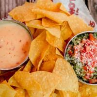 Cha Cha Chips · Choose from salsa, queso, rotel or guacamole.