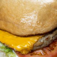 Turkey Burger · Grilled turkey patty, topped with melted American cheese dressed with lettuce, tomato, and m...