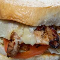 Caitlins Cajun Sandwich · Grilled Cajun chicken breast topped with hickory smoked bacon and melted pepper jack cheese,...