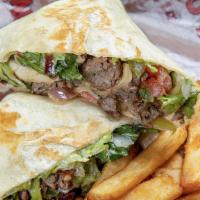 Philly Wrap · Sirloin steak chopped and grilled wrapped in a tortilla with sauteed onions and bell pepper,...