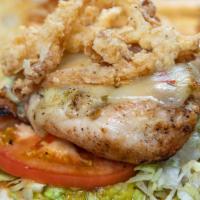 Holy Guacamole Chicken Sandwich · Grilled chicken breast topped with melted pepper jack cheese and fried onion strings, dresse...