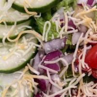 House Salad · Romaine lettuce, cucumber, tomato, onions, organic four flavor cheese. Dressings: raspberry ...