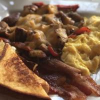 Social House Platter · Two eggs any style, with your choice of sausage or bacon, grits, or breakfast potatoes serve...