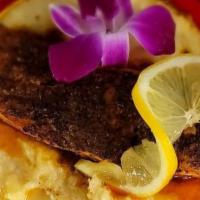Martini Salmon & Grits · Juicy Blackened Salmon served with our Creamy Grits