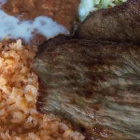Carne Asada · Mexican style steak, served with sour cream, pico de gallo, flour or com tortillas and your ...