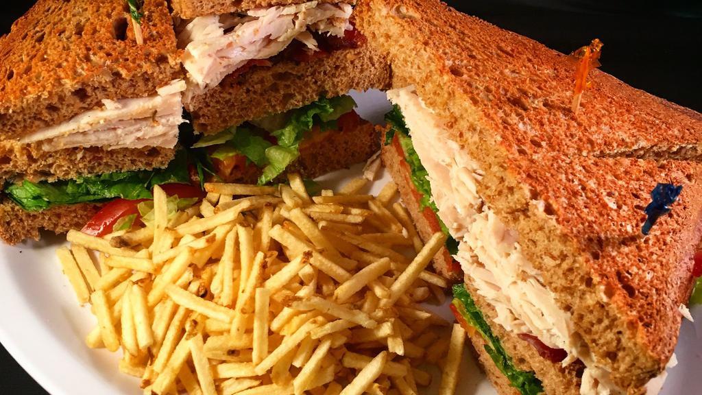 Turkey Club · With bacon, lettuce and tomato.