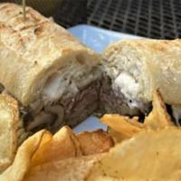 Local Roast Beef · Roast beef, caramelized onions, mushrooms, provolone & horseradish on grilled baguette; serv...