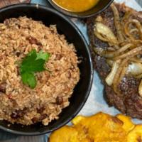 Rib Eye · Grill rib eye prepare to your liking, comes with rice, salad, & fried plantains