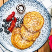 Lemon Ricotta Pancakes · fresh fruit + organic maple syrup.