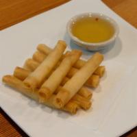 Shrimp Rolls · Fried shrimp rolls wrapped in rice paper and served with dipping sauce.