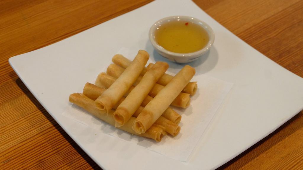 Shrimp Rolls · Fried shrimp rolls wrapped in rice paper and served with dipping sauce.