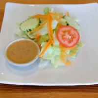 Royal Thai Salad · Lettuce, tomato, carrots, cucumber with ginger dressing.