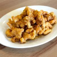 Honey Chicken · Crispy fried chicken breast in golden honey sauce. Served with steamed white rice.