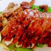 Royal Thai Duck · Deep-fried boneless duck topped with mixed vegetables and special garlic sauce. Served with ...