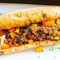 Jerk Chicken Philly Sandwich · Spicy seasoned jerk chicken sandwich with melted cheese, grilled peppers, & grilled onions o...