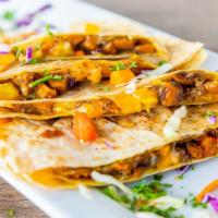 Curried Sweet Potato Quesadillas · Curried sweet potatoes, grilled onions, tri-colored peppers, red cabbage, lightly seasoned w...