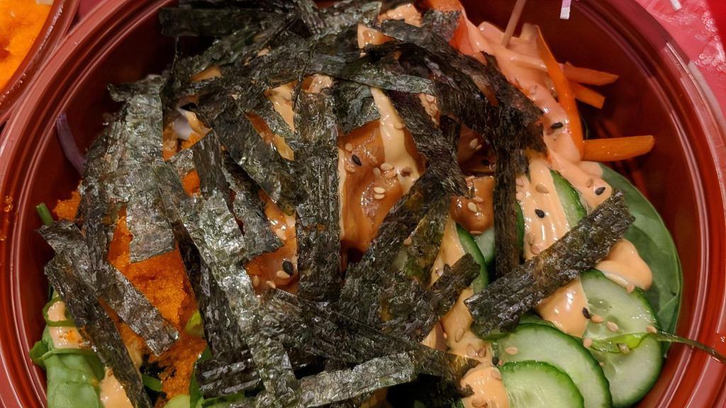 Volcano Bowl · Spicy salmon, spicy tuna, spinach, red onion, jalapeno, cucumber, carrot, seaweed salad, masago with sriracha mayo sauce, sesame seed topping.